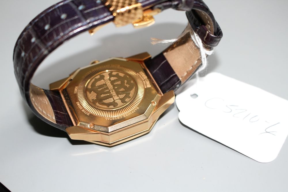 A gentlemans gilt steel Robert Cavalli quartz chronograph wrist watch, with box.